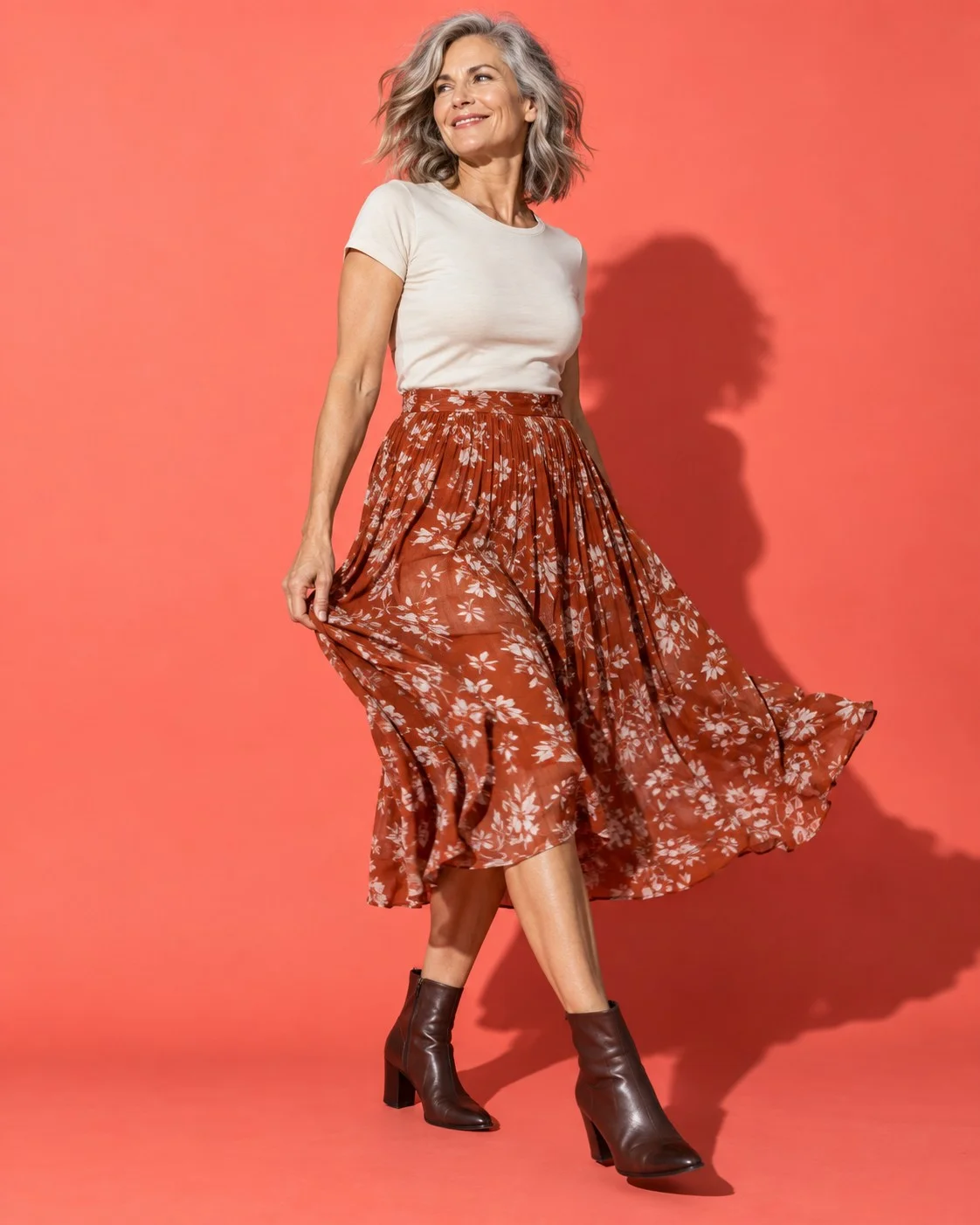 Midi skirt with a close-fitting tee and ankle boots