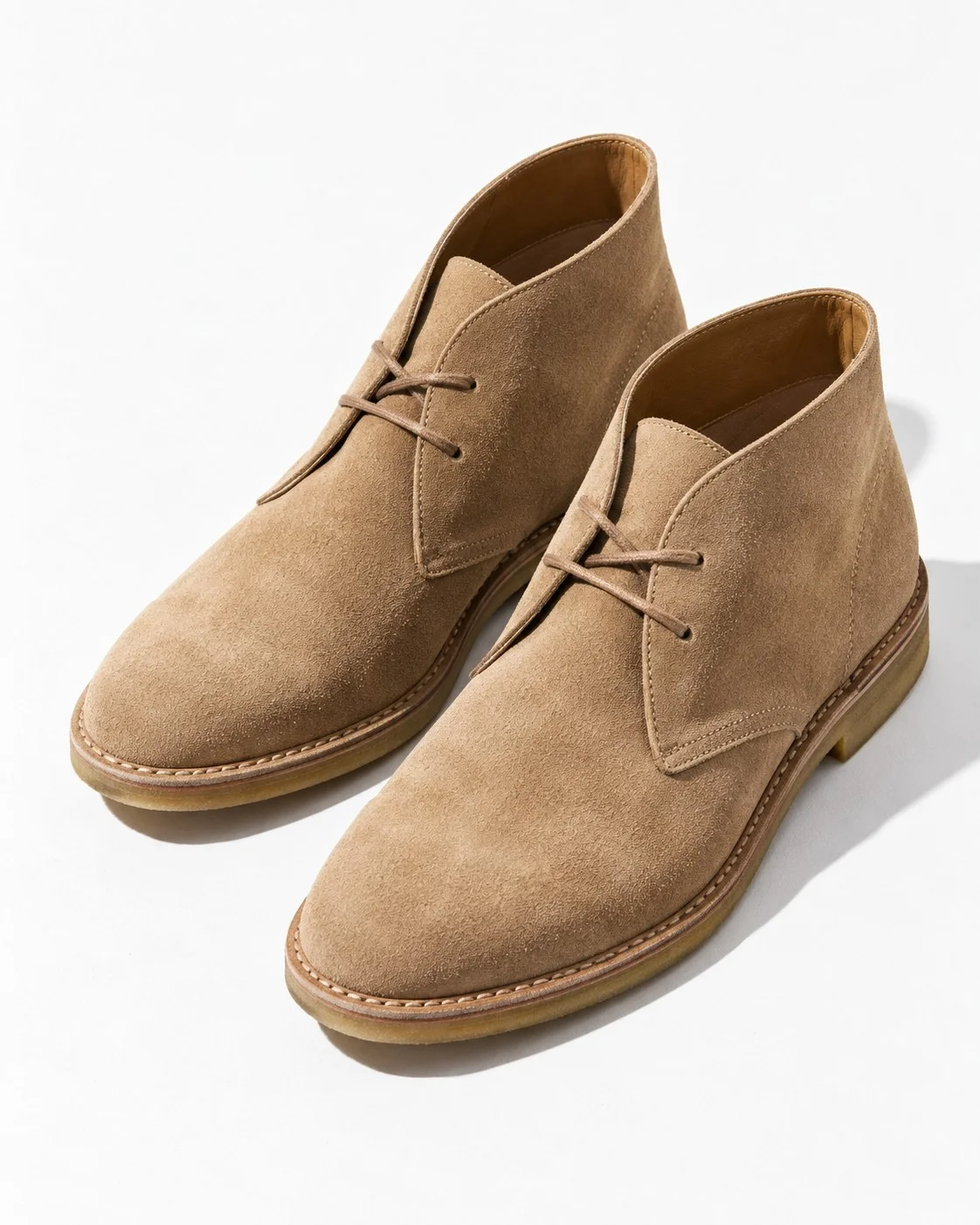 Pair of suede boots shot from a three-quarter angle
